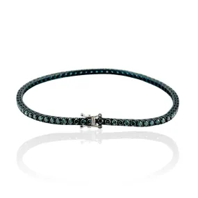 Bracciale tennis in oro con diamanti blu