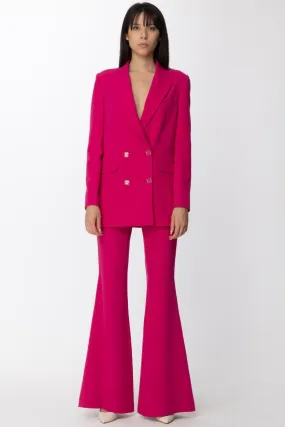 Pantalone a zampa con ciondolo logato Fucsia